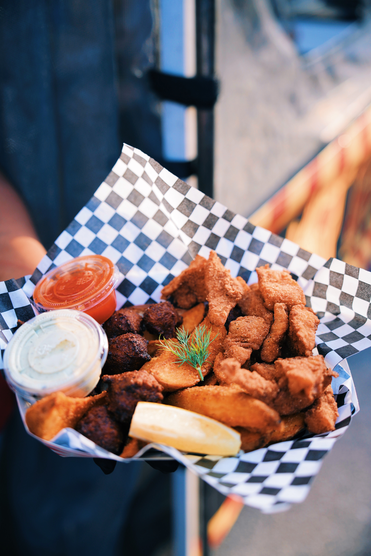 Crispy fried snapper basket with sauces and lemon